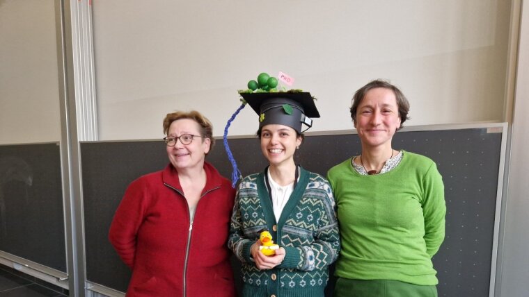 Picture of Göbken Demir and her supervisors after her sucessful defense